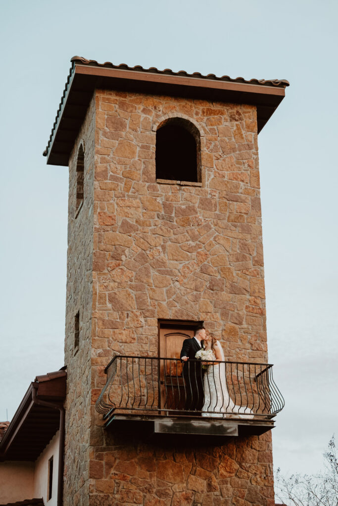 A romantic wedding portrait at Ma Maison’s Bell Tower, a stunning spot for couples planning a wedding in Austin