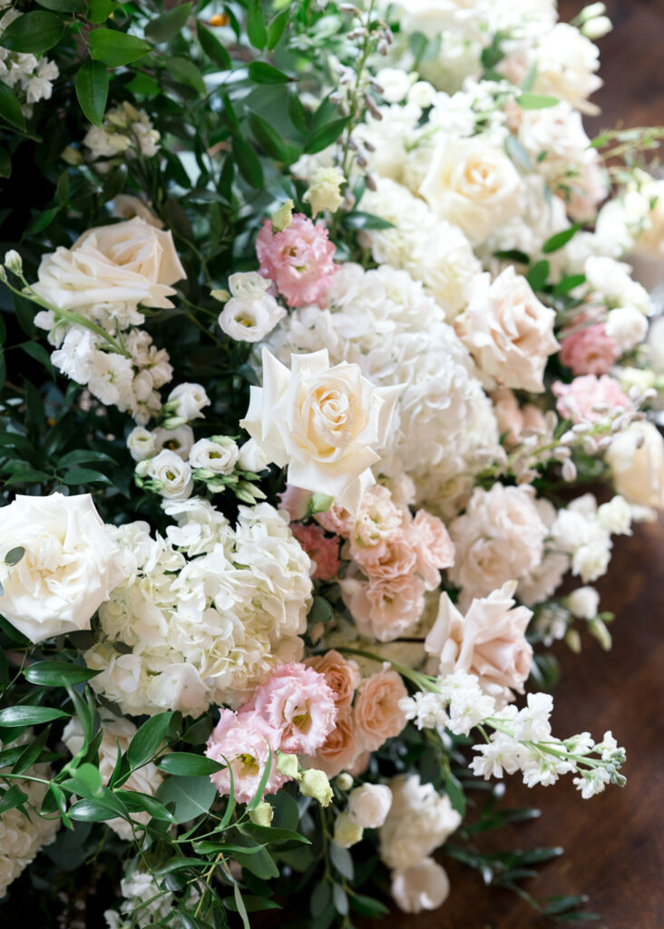 Detailed floral arrangement showcasing roses, lisianthus, and hydrangeas designed by the best wedding florist in Austin, ideal for an elegant and sophisticated wedding look.