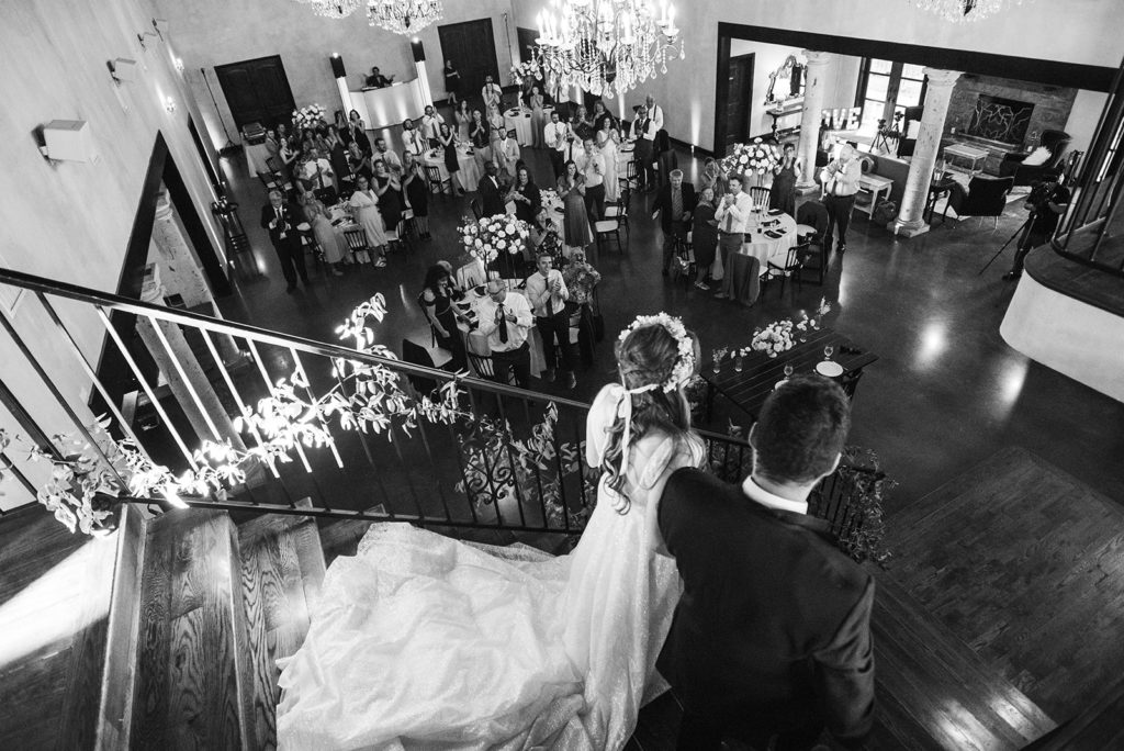 couple entering their reception at Texas wedding venue