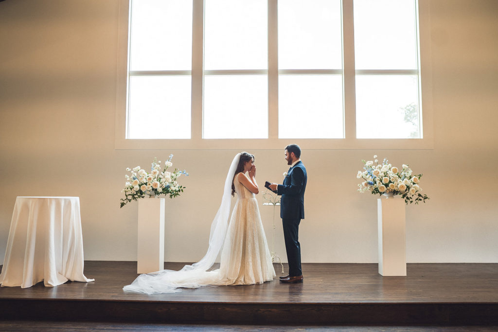 Couple getting married inside chapel at Texas wedding venue