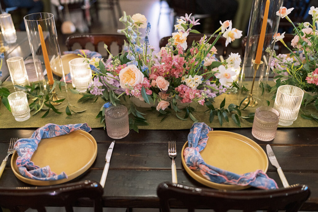 Elegant wedding tablescape with pastel blooms and candles