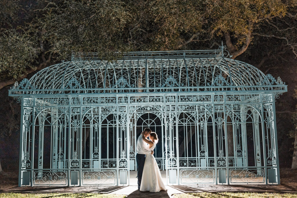 Romantic couple at outdoor gazebo showing how to choose wedding vendors