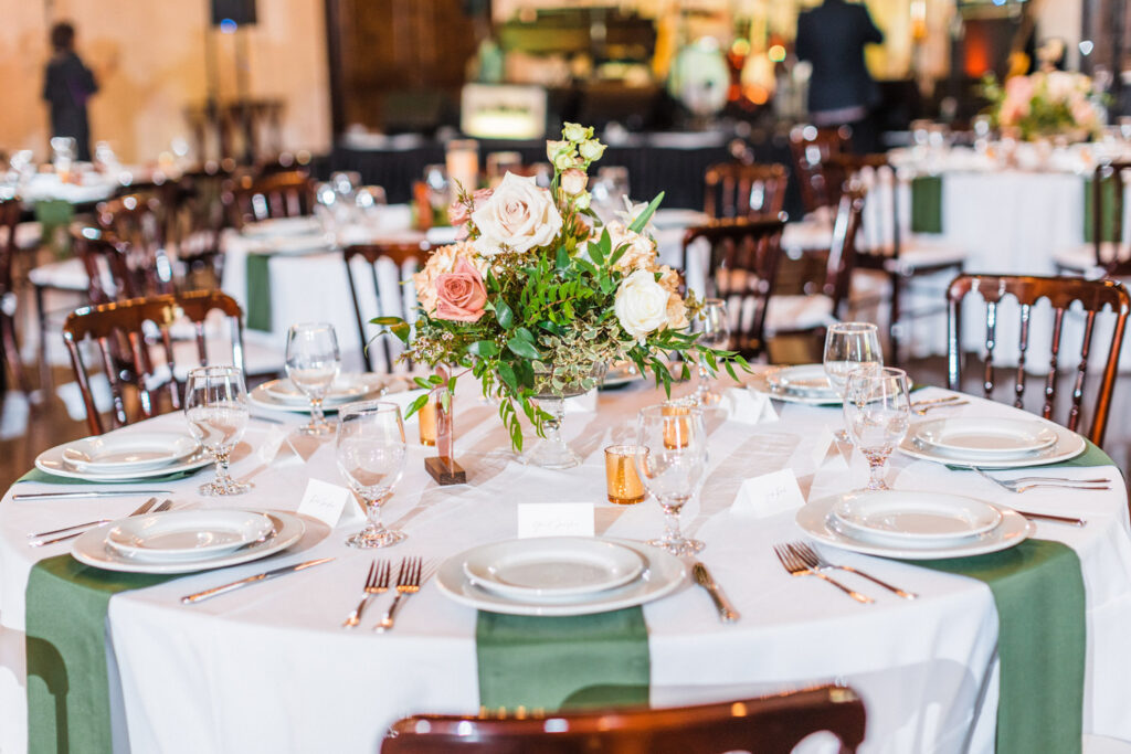 Wedding reception table with floral centerpiece
