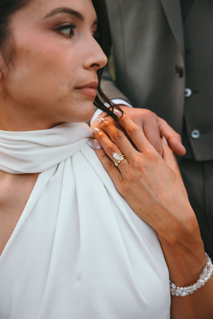 Bride’s hand with pear-shaped lab-grown diamond engagement ring