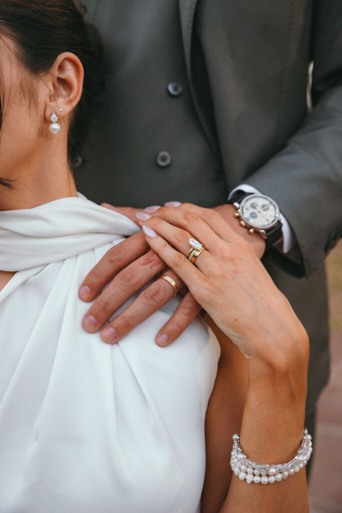 Elegant close-up of bride's jewelry featuring lab-grown diamond rings