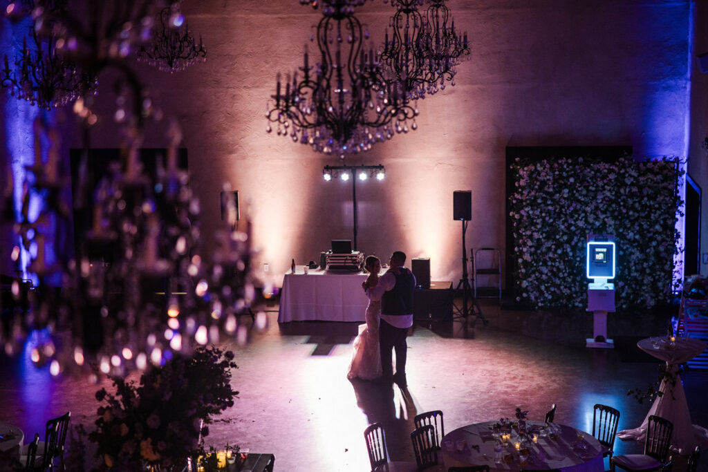 Couple dancing under chandeliers at a unique wedding venue in Austin