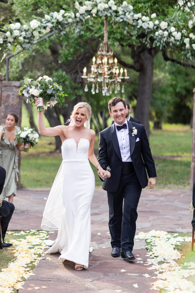 Joyful wedding design with couple celebrating outdoor ceremony at Ma Maison