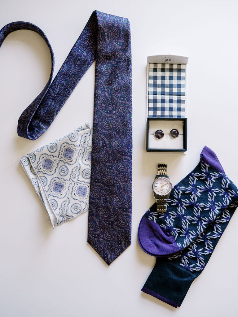 Groom’s tie, watch, and accessories prepared