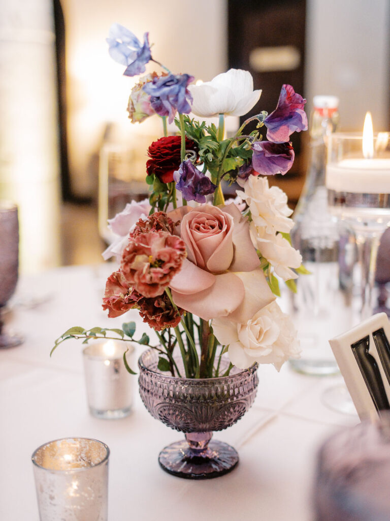 Table centerpiece with candles and roses