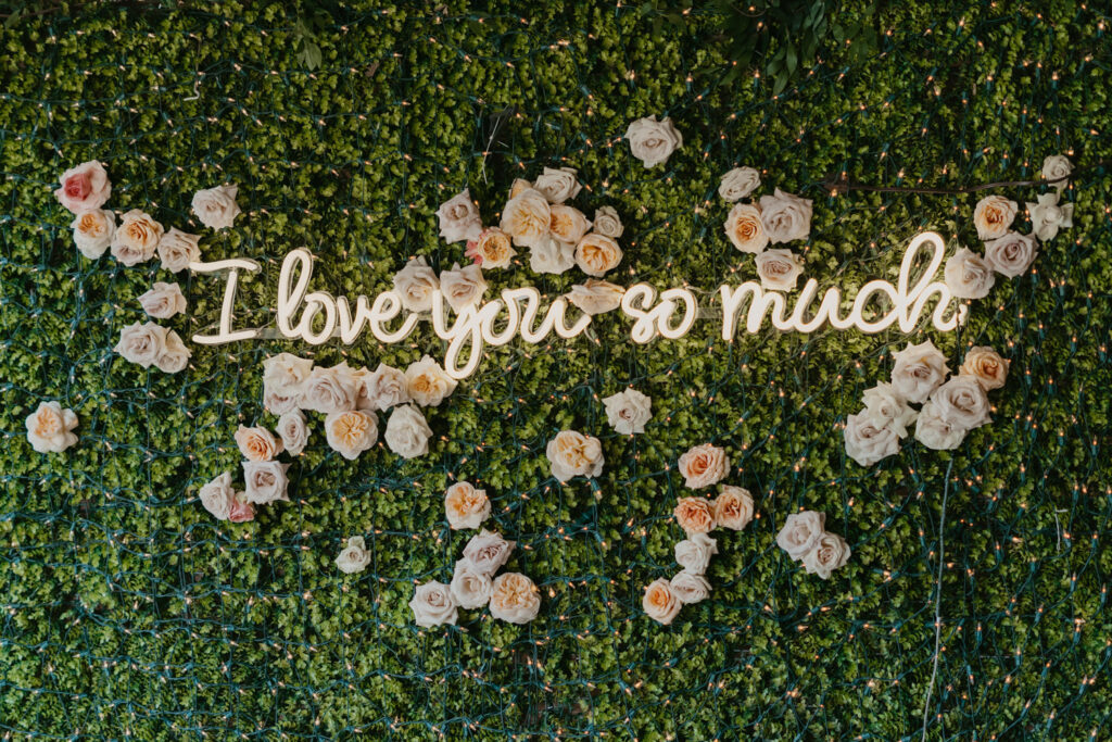 Floral neon sign wall with roses highlighting trends